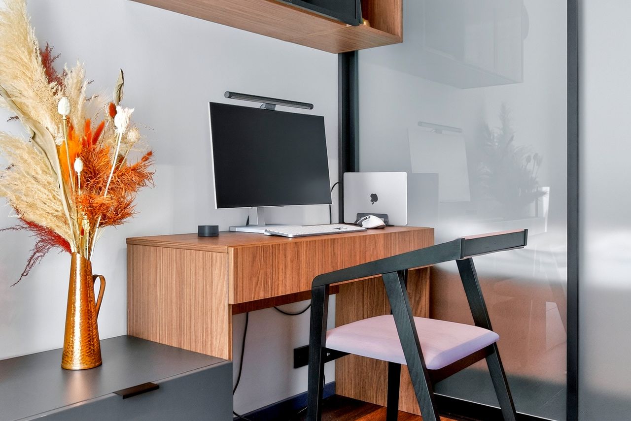 The desk with a 27-inch monitor