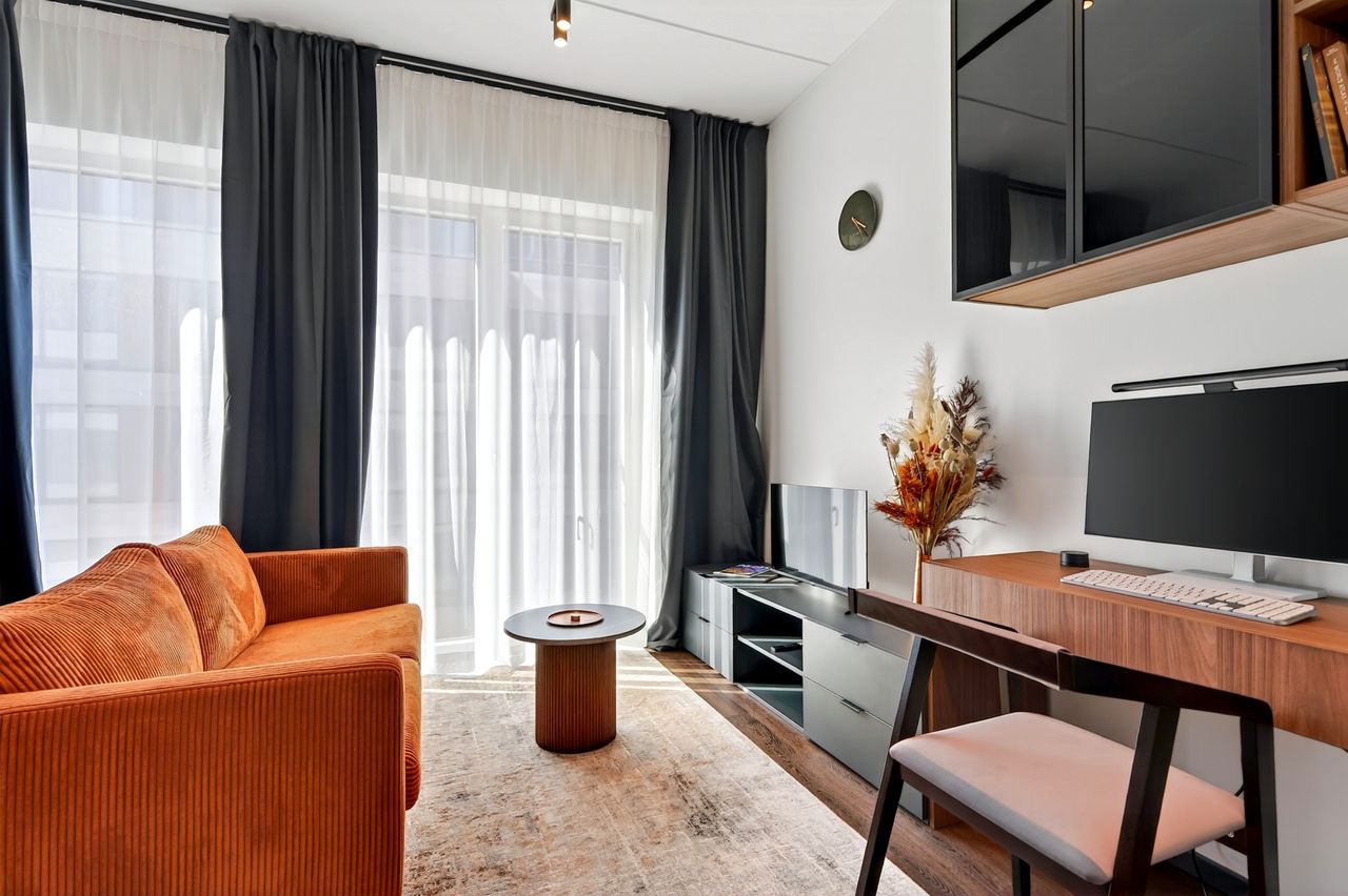 Living area with sofa and desk